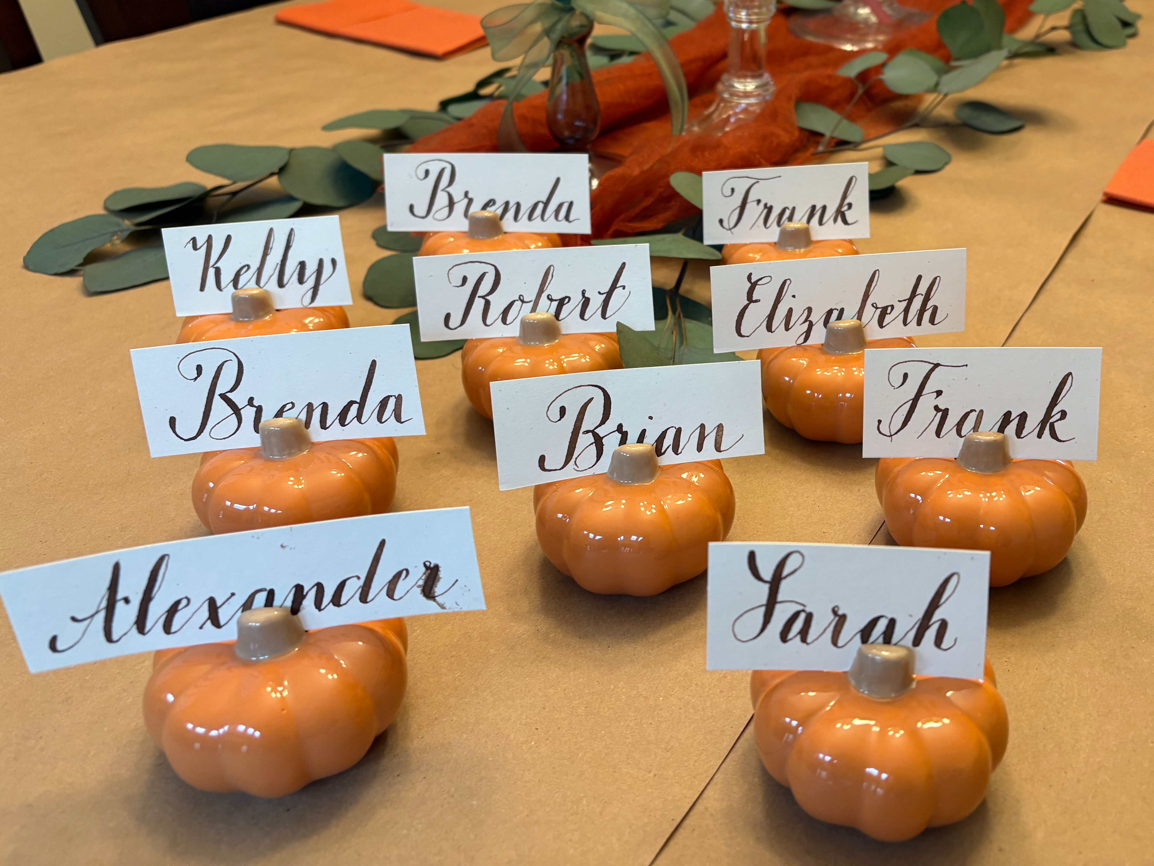 Thanksgiving, personalized placeholders, miniature pumpkins, copperplate calligraphy.
